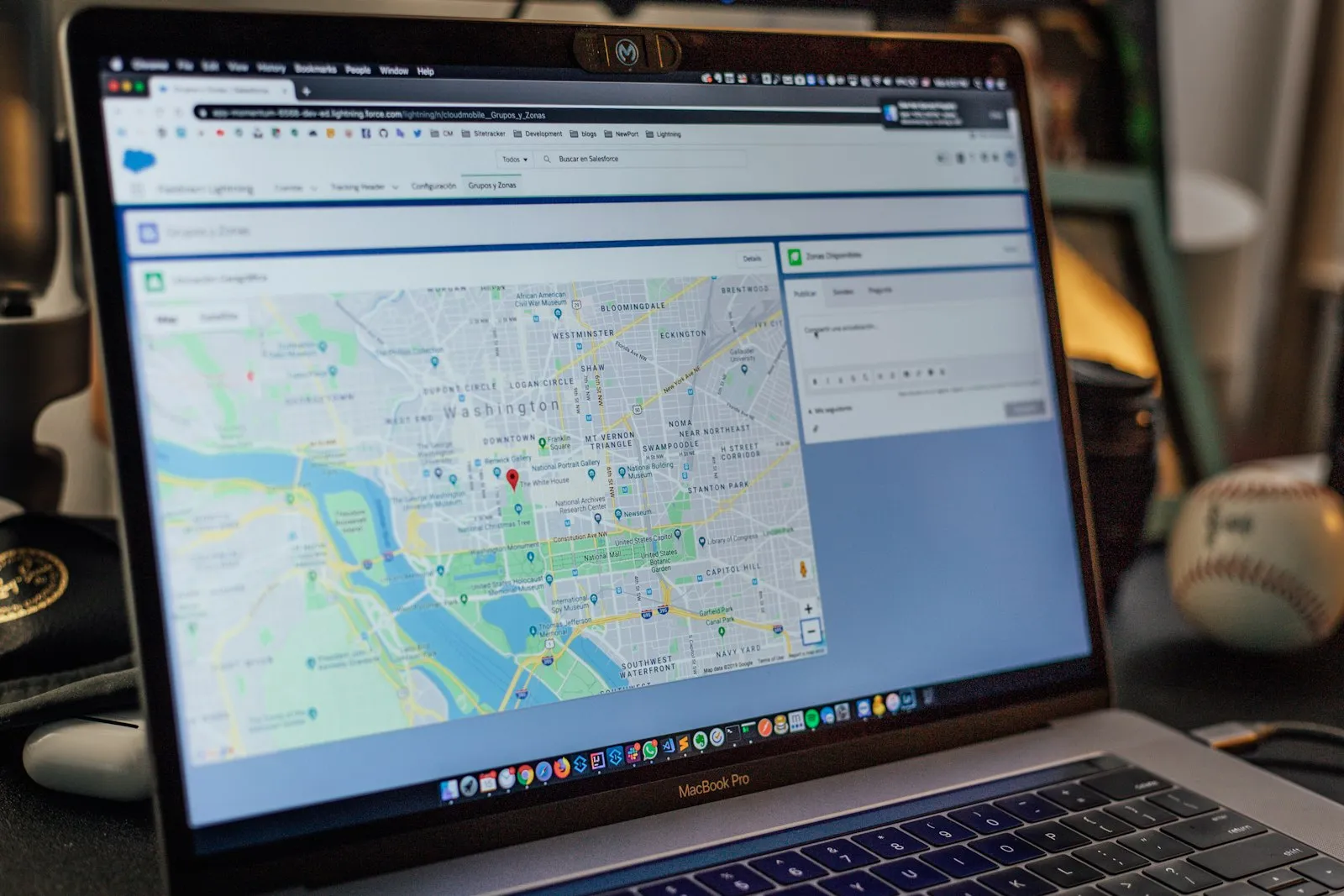 World map on laptop screen — multilingual website for global tourism audience